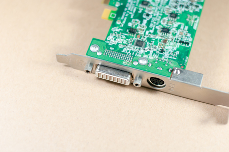 graphic card or display card on a yellow background. a part of computer desktop, selective focus at DVI portの写真素材