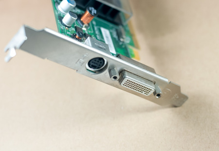 graphic card or display card on a yellow background. a part of computer desktop, selective focus at DVI portの写真素材