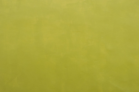 Concrete wall dark yellow color for texture backgroundの写真素材