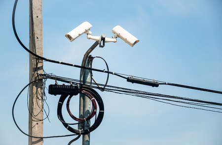 surveillance cameras on blue backgroundの写真素材