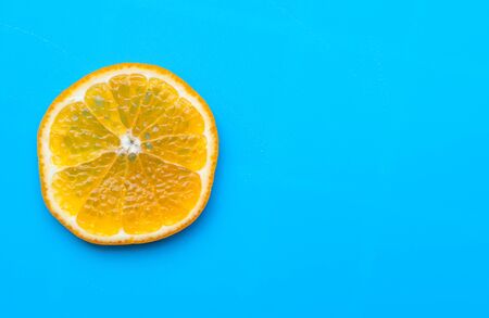 Summer of slice orange fruit on blue backgroundの写真素材