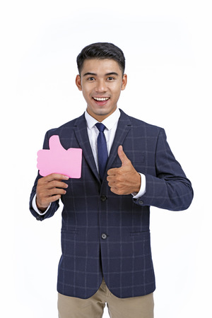 Asian young handsome business man isolated on white background with copy spaceの写真素材
