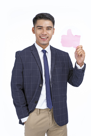 Asian young handsome business man isolated on white background with copy spaceの写真素材