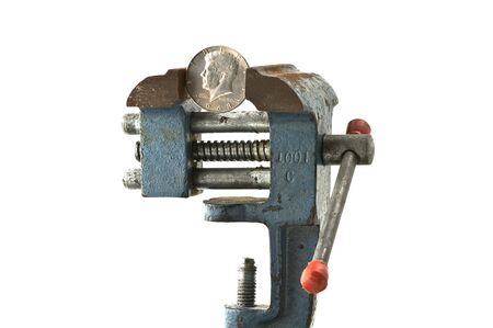 Coin in and old and rusty viceの写真素材