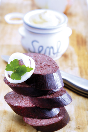 Sliced blood sausage with onions