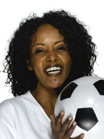 Young woman from Togo holding soccer ballの写真素材