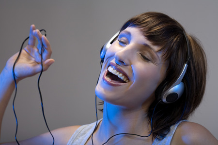 Woman listening to music, close-upの写真素材