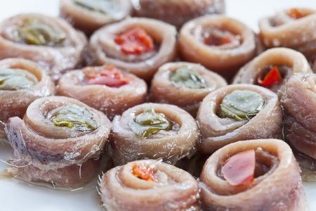 Anchovies filled with capers and tomatoes, close-upの写真素材