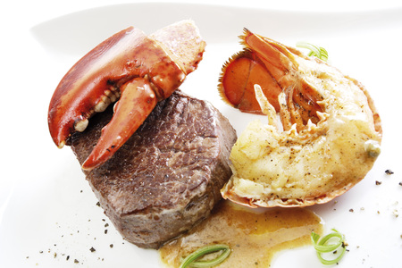 Surf and turf filet steak with seafoodの写真素材