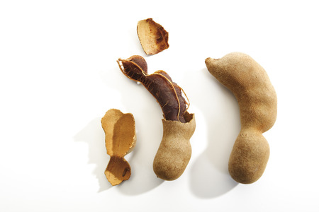 Broken and whole Tamarind podsの写真素材