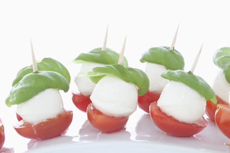 Mozzarella with Basil on white background, close upの写真素材