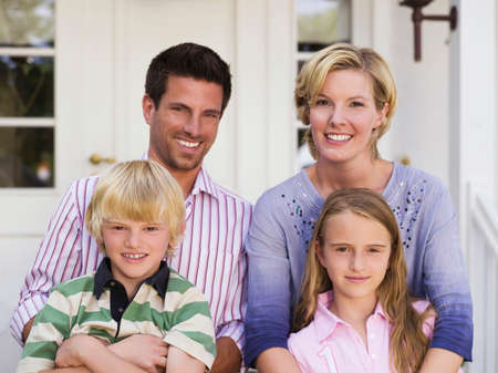 Family in front of house