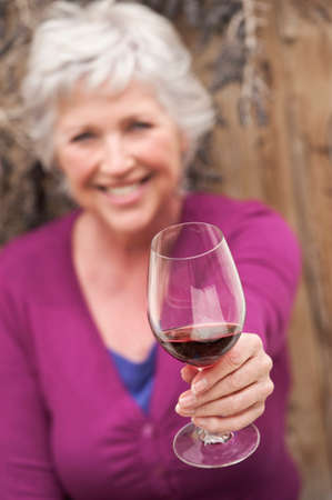 Mature woman with wine glass