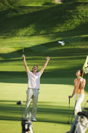 Italy, Kastelruth, Golfers playing golfの写真素材