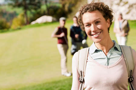 Italy, Kastelruth, woman on golf course smilingの写真素材