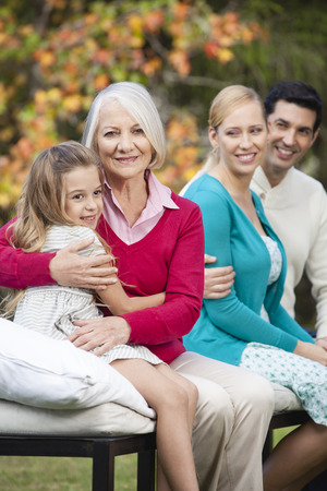Happy family in gardenの写真素材