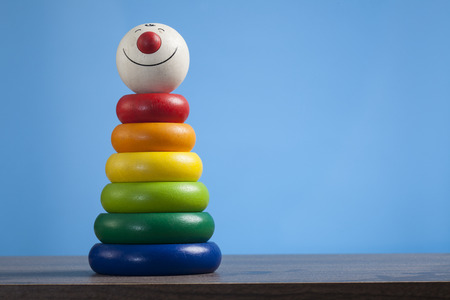 Colorful toy pyramid with clown's faceの写真素材