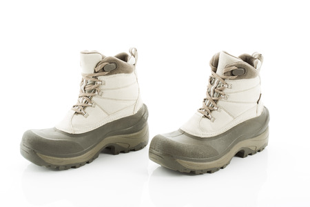 Pair of winter boots against white backgroundの写真素材