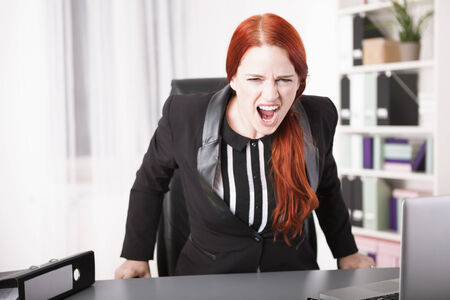 Young businesswoman screamingの写真素材