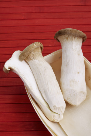 King trumpet mushrooms in wooden punnetの写真素材