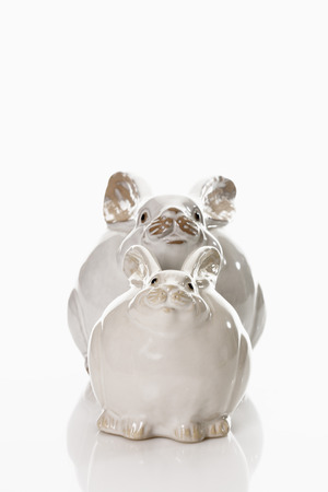 Two porcelain Easter bunny on white backgroundの写真素材