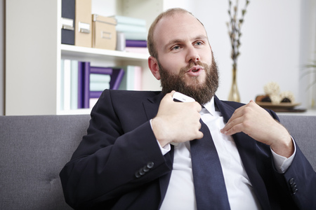 Businessman explaining something, gesturing with hands