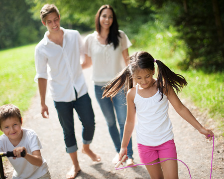 Young happy family talking a summer walkの写真素材