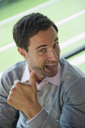 Germany, businessman showing thumbs upの写真素材