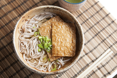 Kitsune soba, Japanese buckwheat noodles with marinated, fried tofuの写真素材