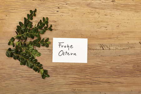 Card Happy Easter, twigs on woodの写真素材
