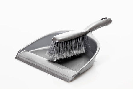 Dustpan and hand brush on white backgroundの写真素材