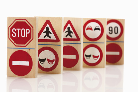 Domino with traffic signs on white backgroundの写真素材