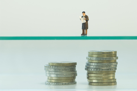 Businessman figurine planning about retirement pension