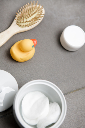 Wellness, rubber duck, hairbrush, bowl with eye pads, cream jarの写真素材