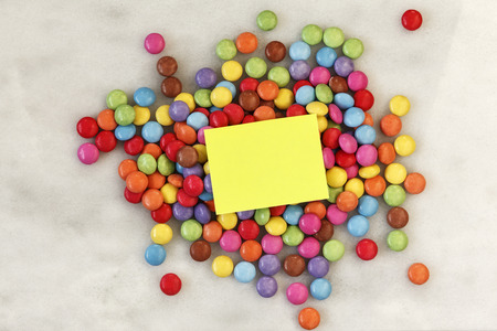 Smarties on marble, blank note