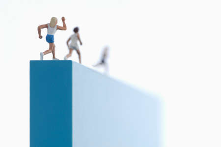 figurines running on a block.の写真素材