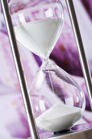Hourglass and 500 Euro notesの写真素材