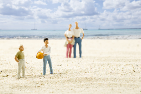 Figurines on beach, holiday