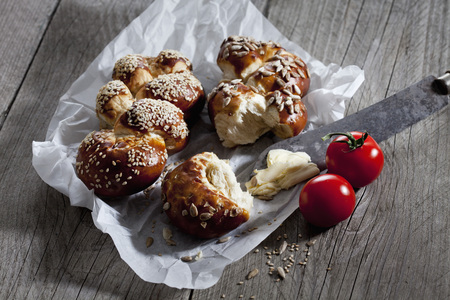 Lye pastry, lye plait with sunflower seeds and butterの写真素材