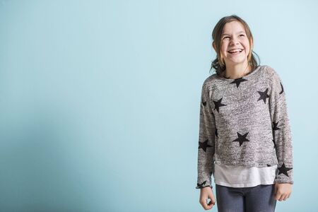 Happy young girl smiling happilyの写真素材