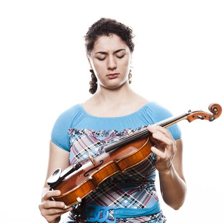 Emotional young violinist playing musicの写真素材