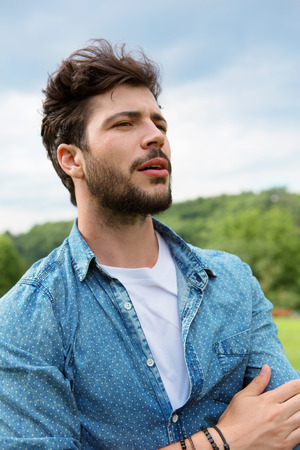 Young man with beard and brown hairの写真素材