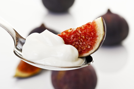 Figus with curd on spoon