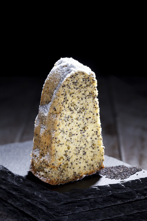 Poppy seed cake on slateの写真素材