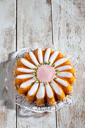 Margarethen fancy cake, marzipan cake, icing and garnished with pistachios