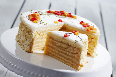 Decorated wine cream cake on cake stand