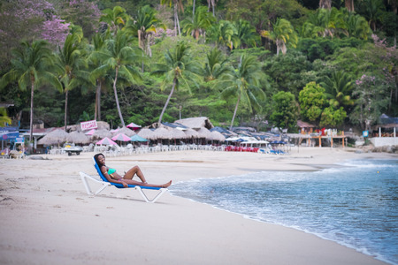 Beautiful black woman wearing bikini on the beach, Mexicoの写真素材
