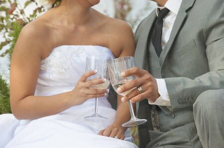 Bride andgroom drinking champagneの写真素材