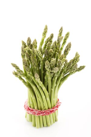 Bunch of green asparagus on white backgroundの写真素材