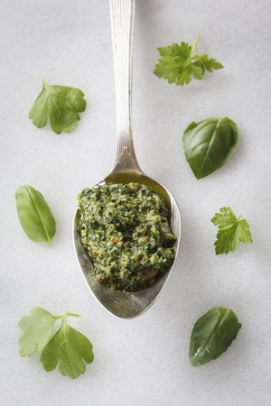 Spoon with vegan parsley basil pestoの写真素材